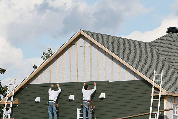 Professional Storm Damage Siding Repair technician working in Pataskala, OH